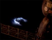 Photograph of a thunderstorm taken by astronaut Andreas Mogensen from the International Space Station (ISS). The storm occurred over East India on September 8th, 2015. The edge of the Soyuz launcher attached to the ISS is also visible.